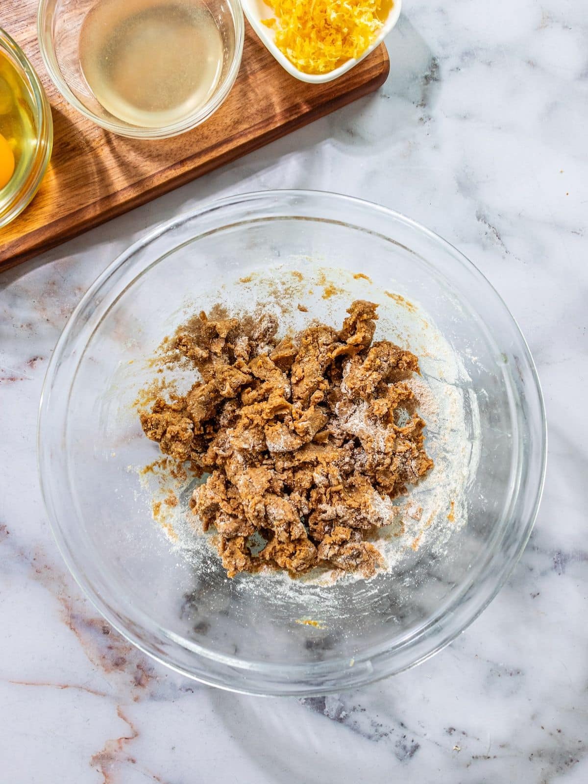 Flour, oil, sugar, milk, lemon juice and salt mixed in a bowl..