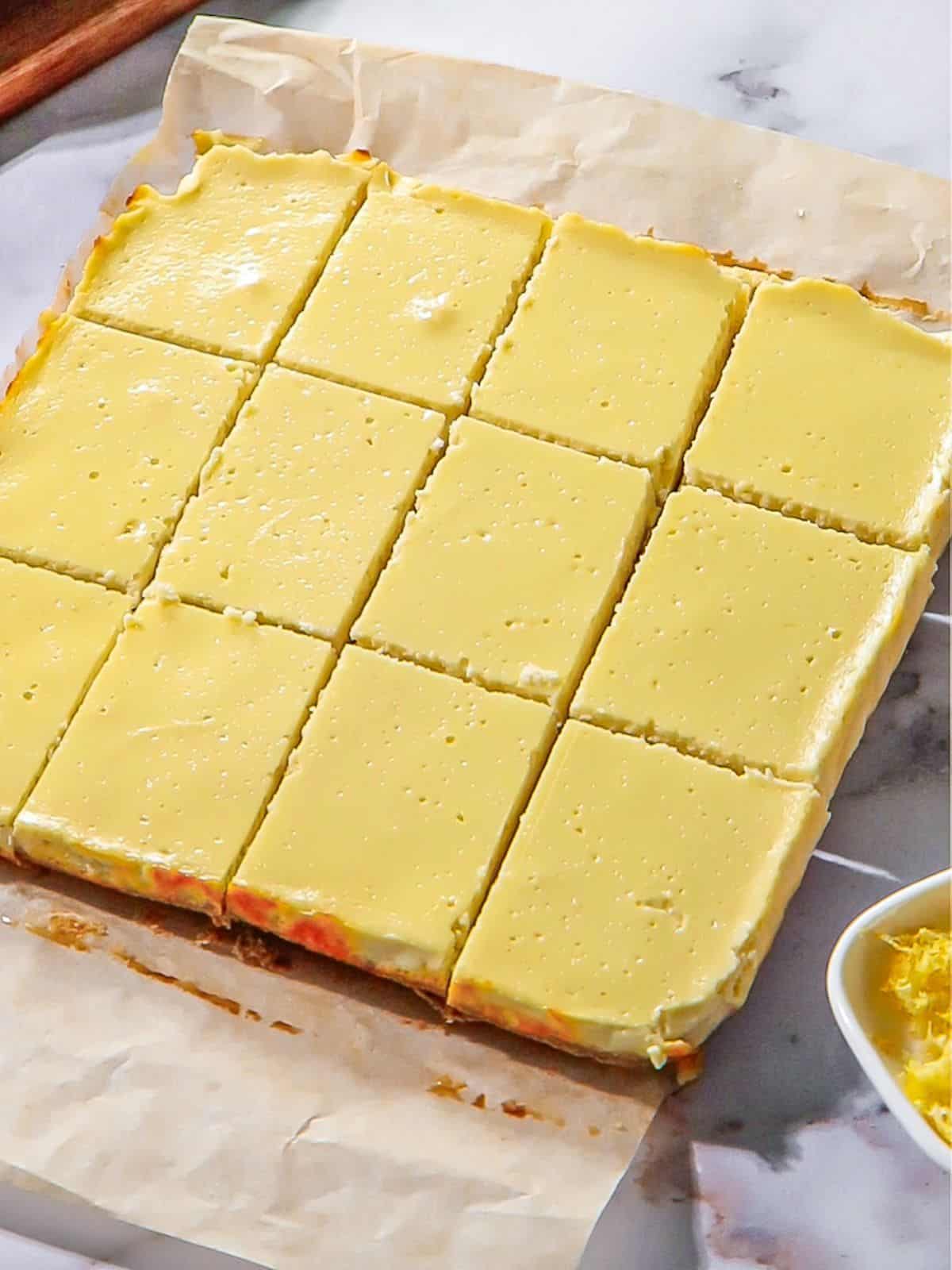 The lemon bars cut into squares.