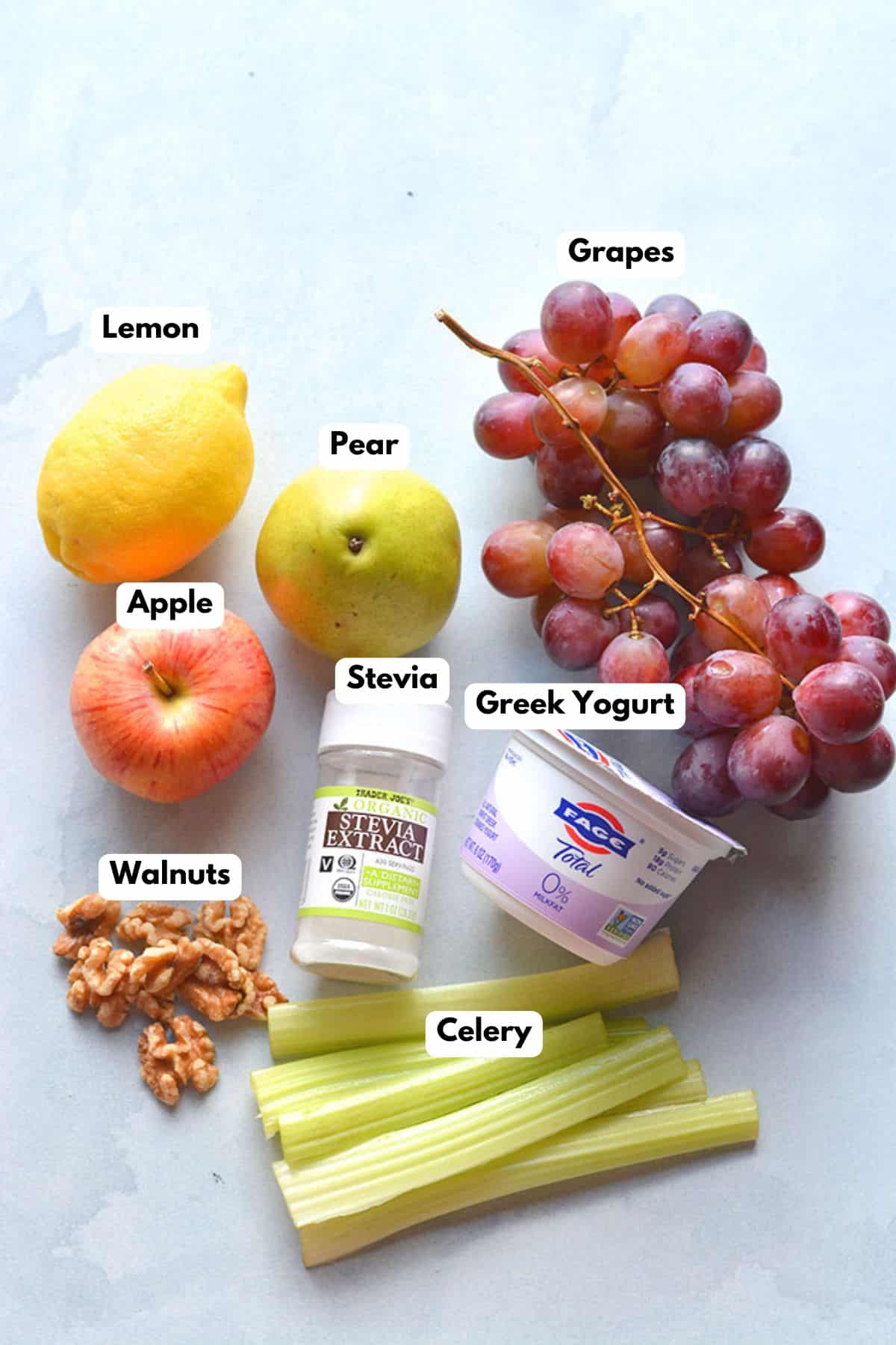 Ingredients to make this low calorie Waldorf salad on a table.
