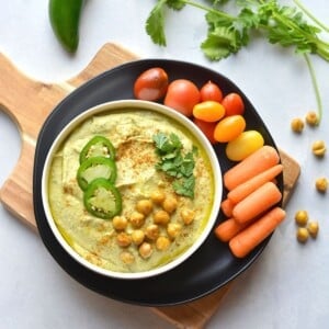 Jalapeno hummus topped with cilantro, chickpeas and jalapeños.