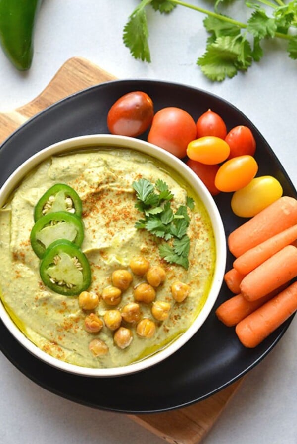 Jalapeno hummus topped with cilantro, chickpeas and jalapeños.