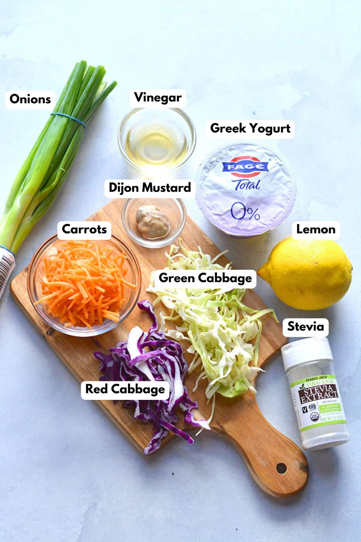 Ingredients to make this healthy cole slaw on a table.
