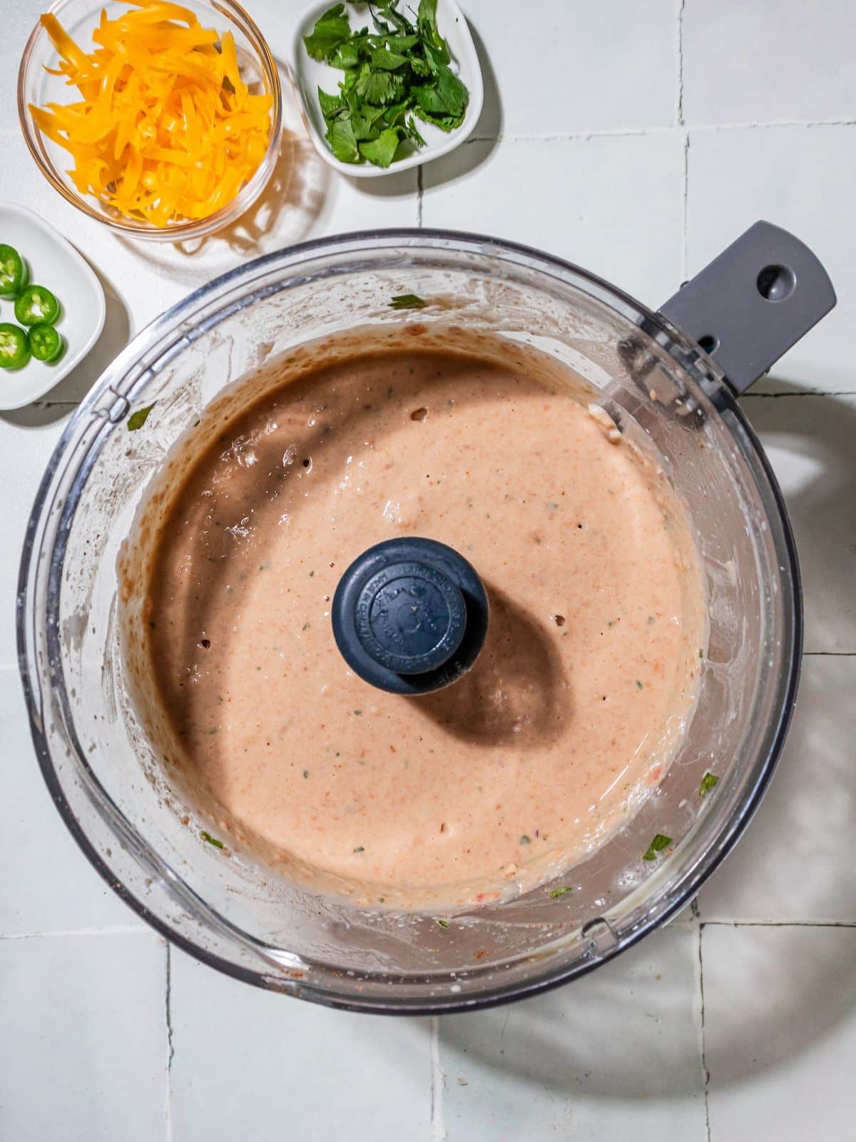 Beans, yogurt and water in a food processor and blended.