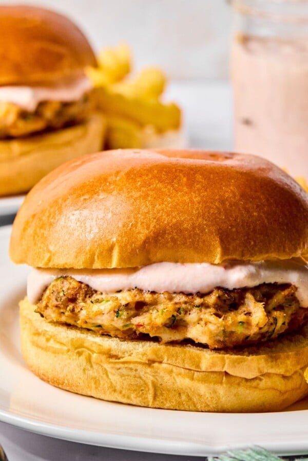 Zucchini turkey burgers on a plate with a side of fries.