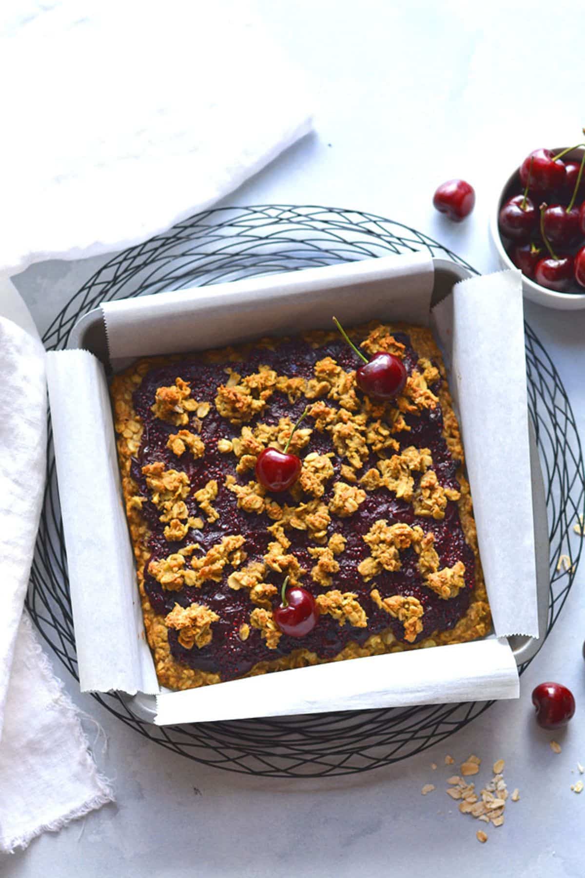 Cherry oatmeal bars in a sheet pan.