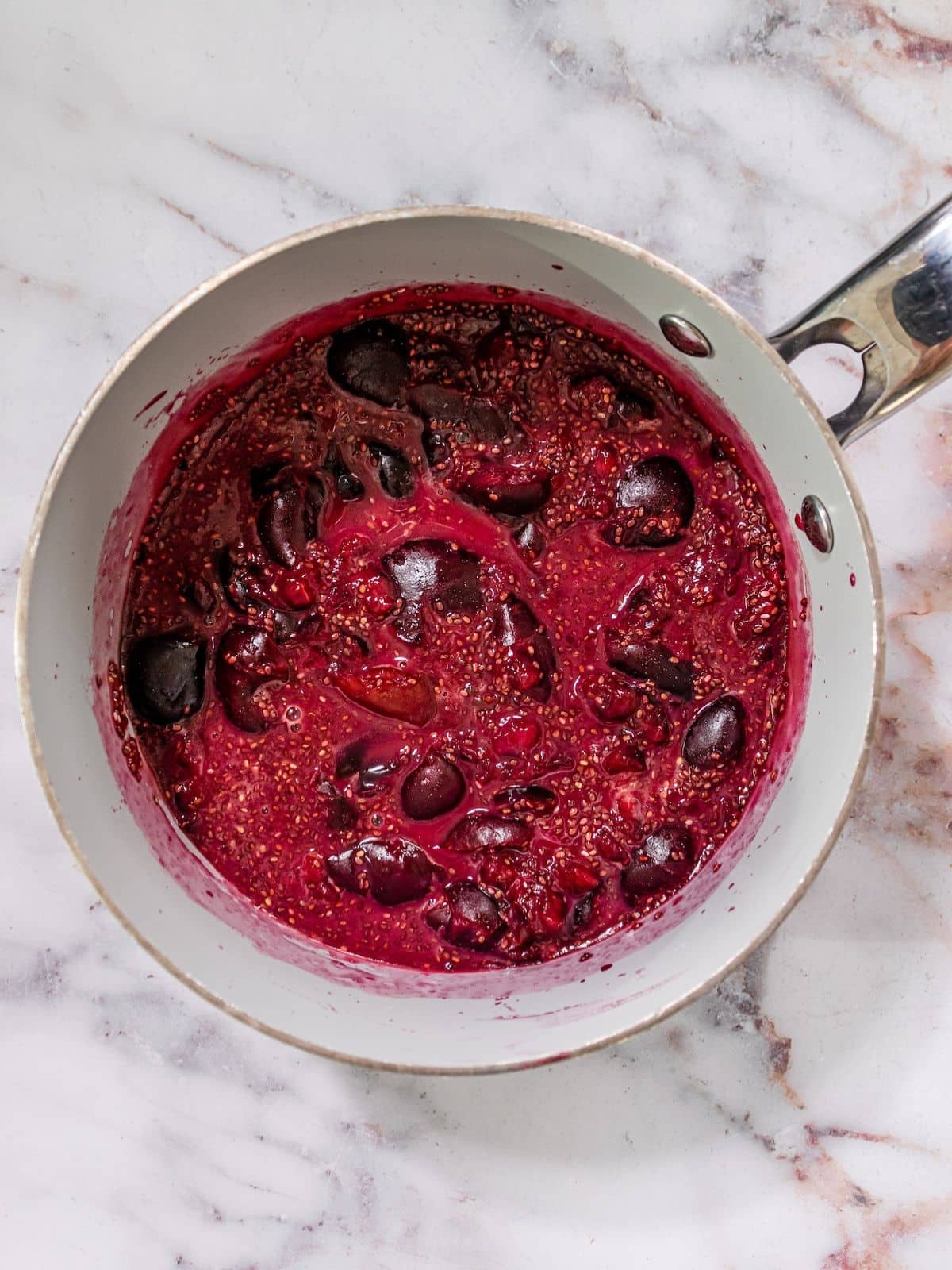 Cherries, monkfruit and chia seeds in a pot.