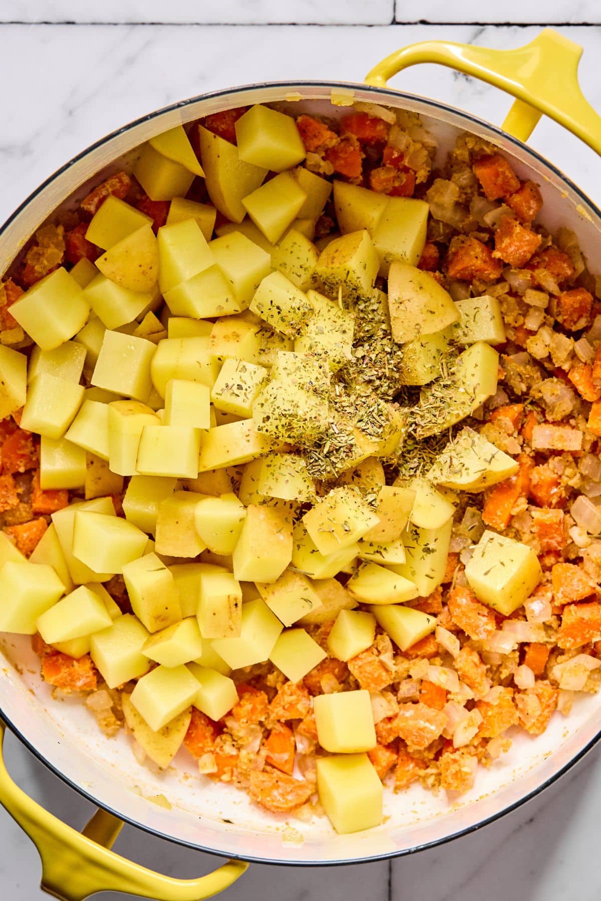 Potatoes and spices added to the pot.
