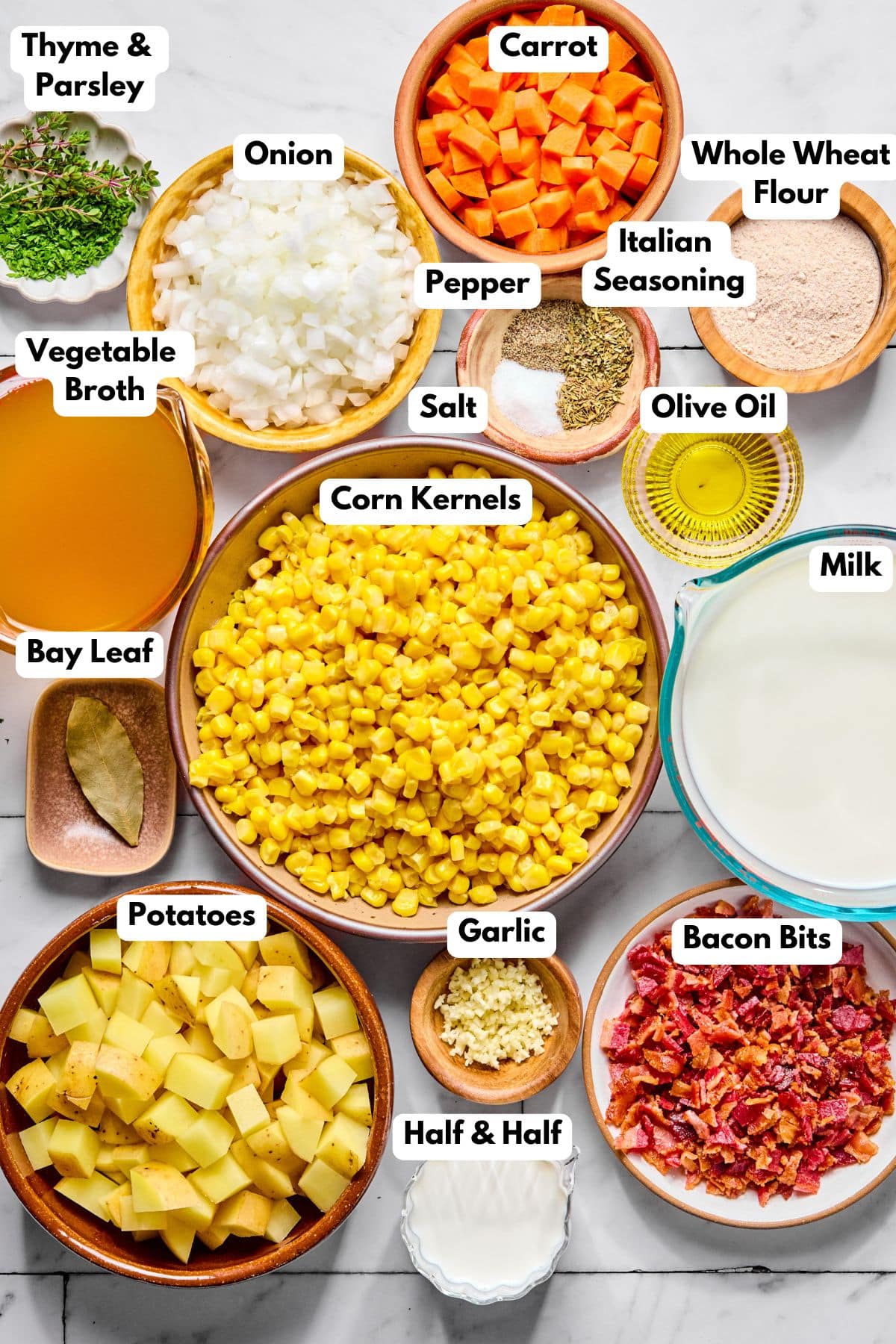 Ingredients to make a healthy corn chowder in bowls on a table.