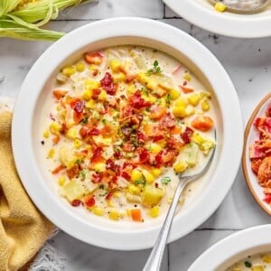 Healthy corn chowder with bacon bits on top.