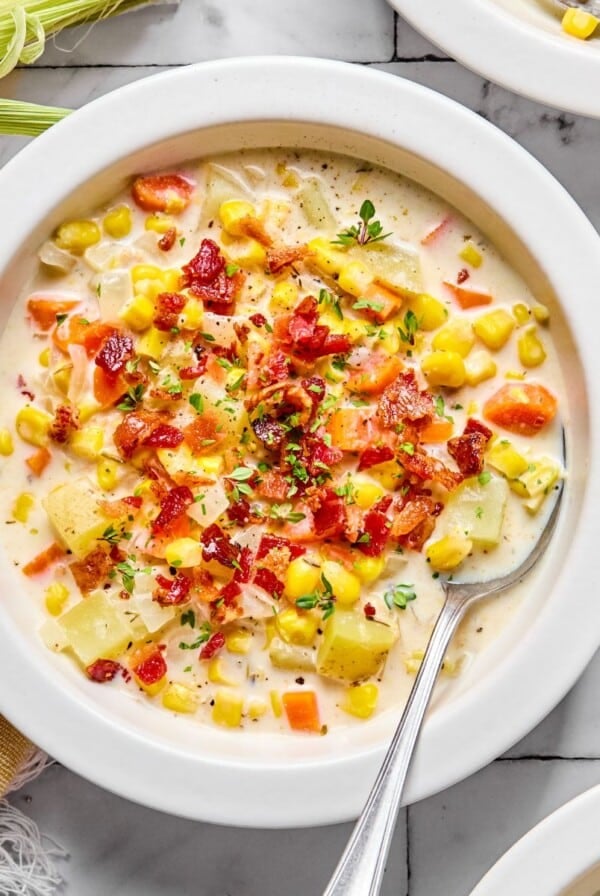 Healthy corn chowder with bacon bits on top.