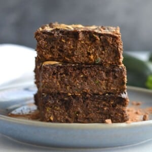 Healthy zucchini brownies on a plate.