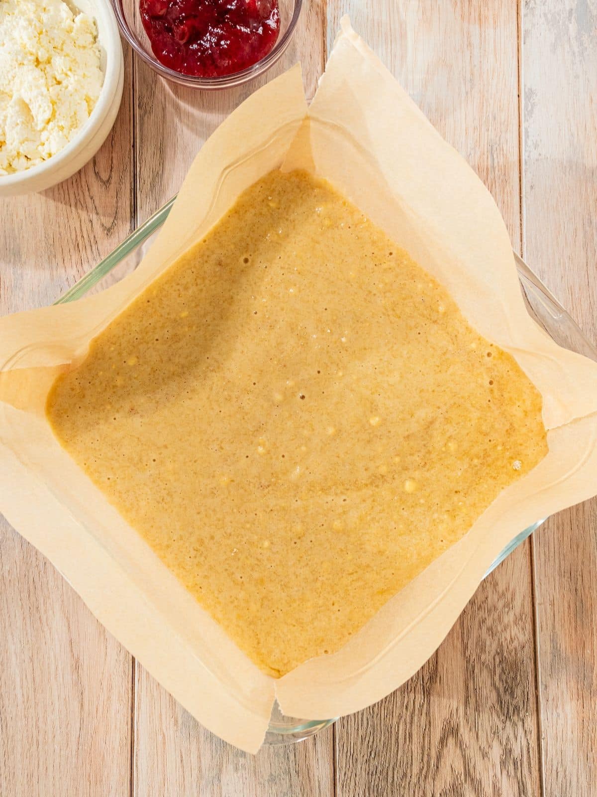 The batter to the prepared baking dish and smooth with a spatula in an even layer.