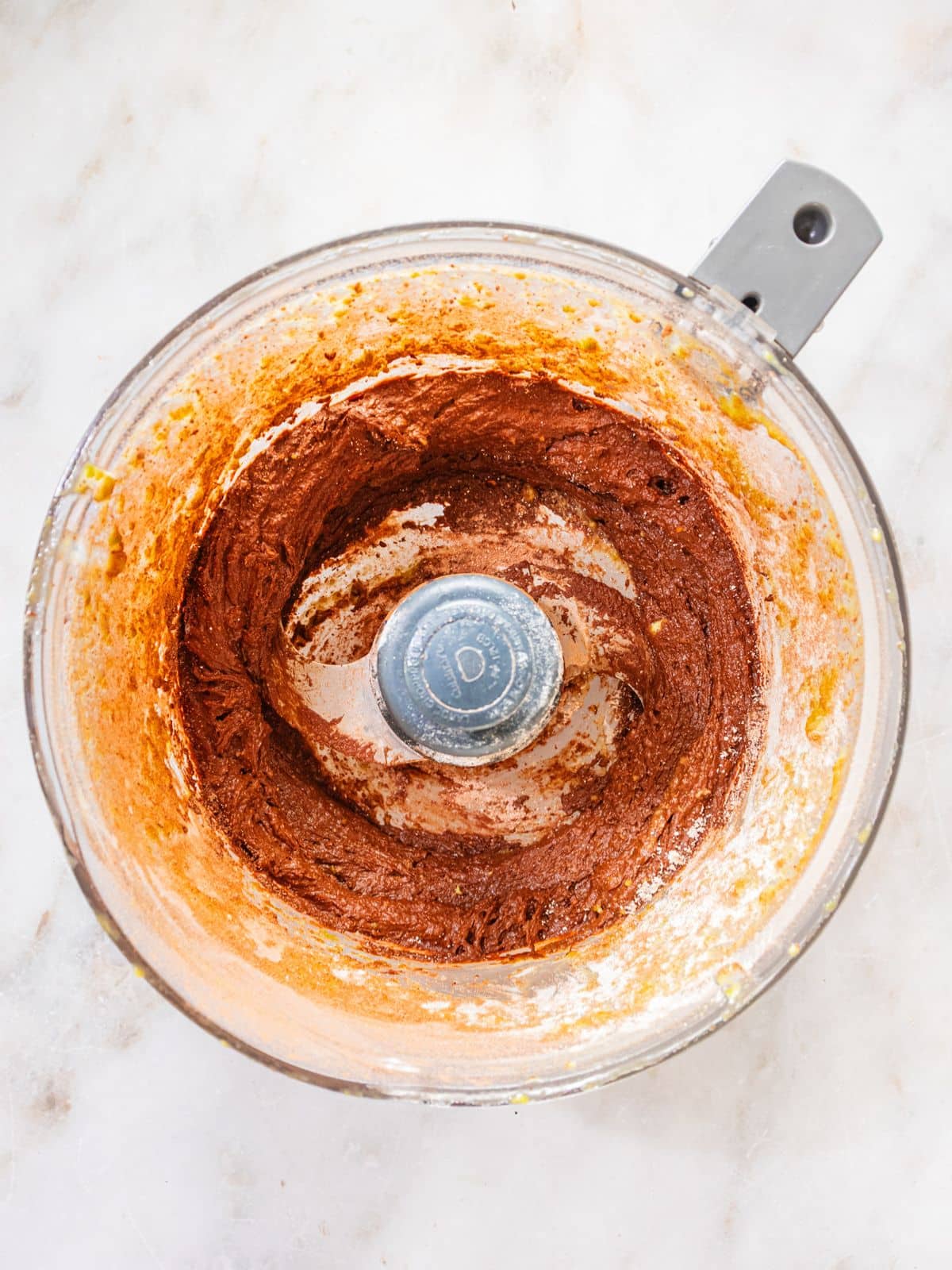 The avocado, maple syrup, vanilla extract and egg in a blender.
