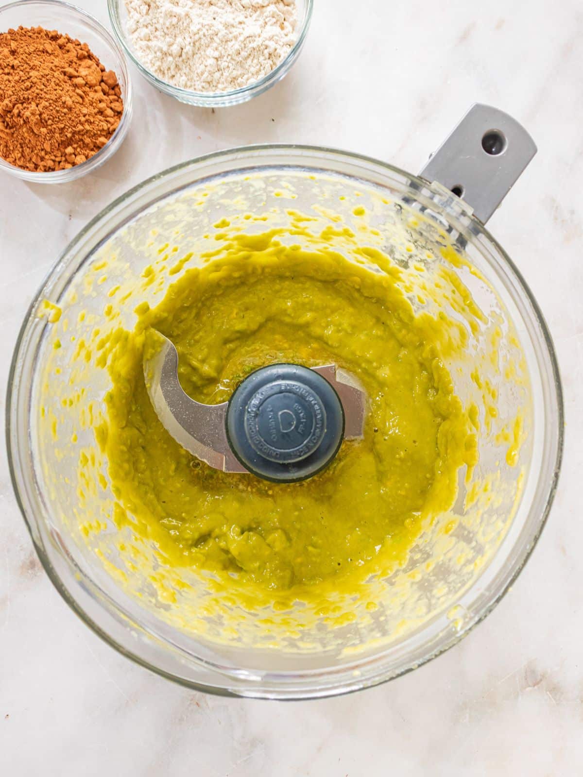 Avocado, salt, cocoa powder, baking soda and oat flour added to the blender.