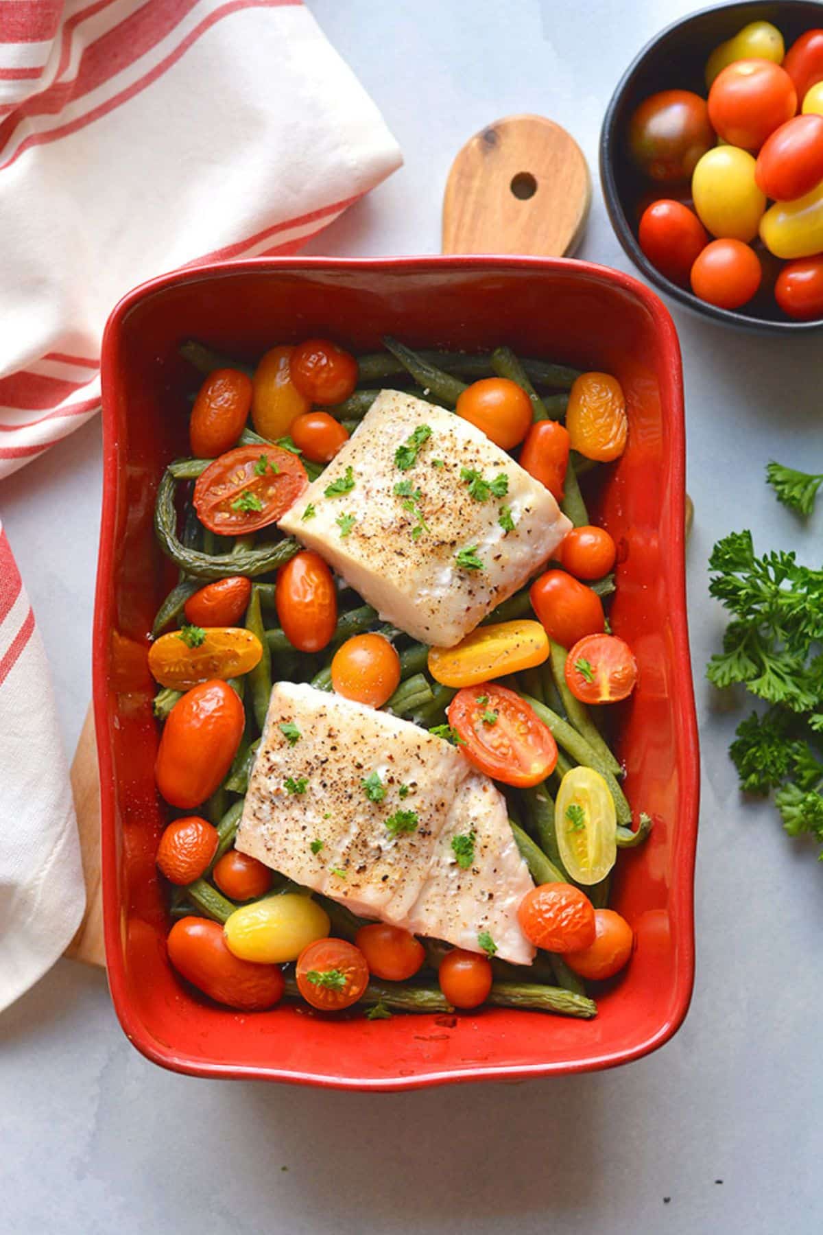 Baked halibut recipe in a baking dish.