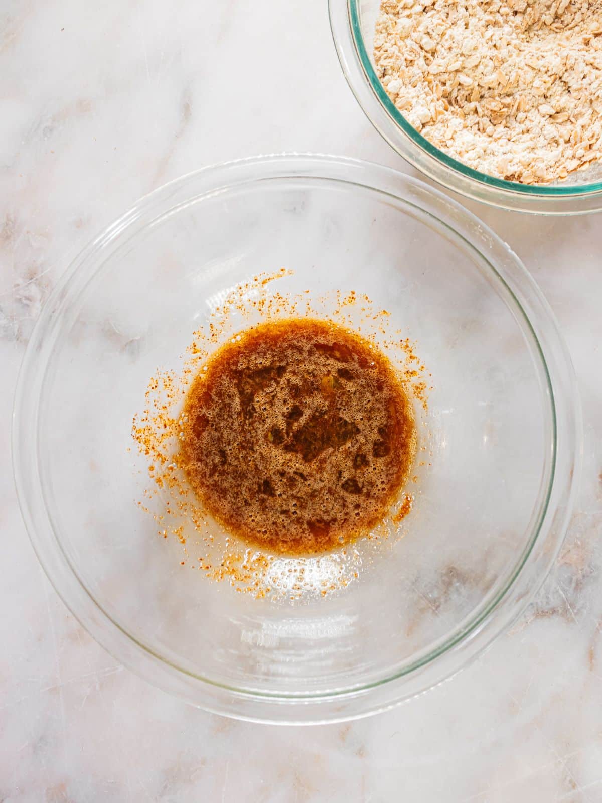 Egg, maple syrup, sugar and salt in a bowl.