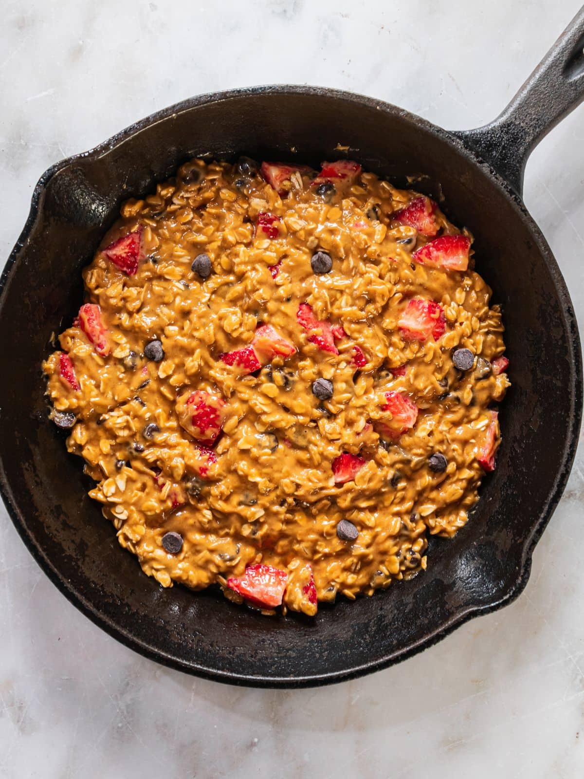 The batter added to a skillet.
