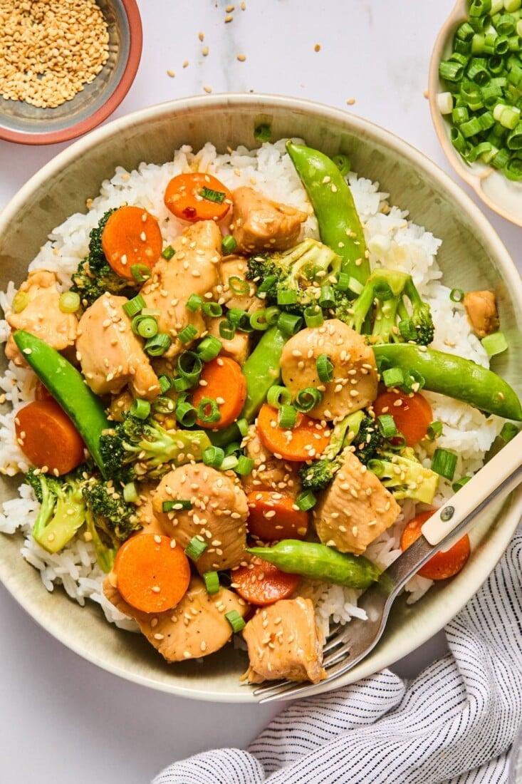Chicken and veggies with teriyaki sauce in a bowl.