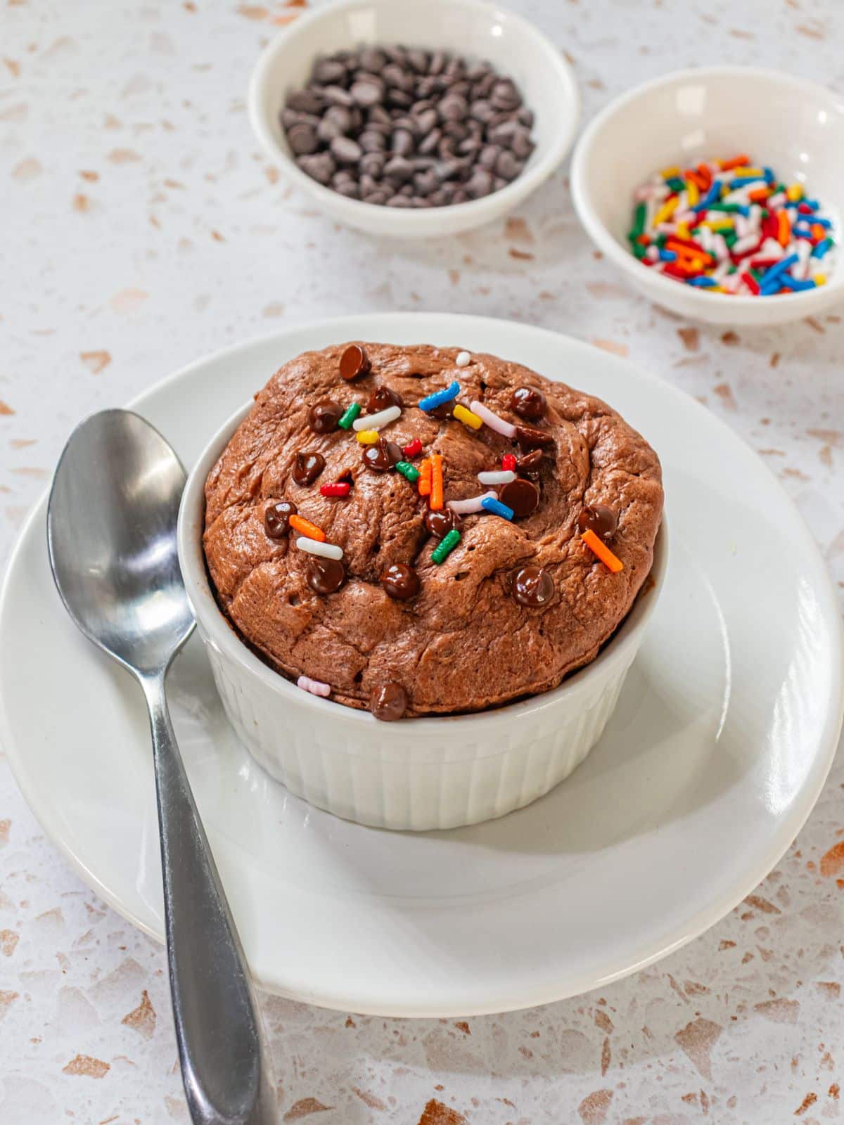 A single serve protein cookie in a ramekin.