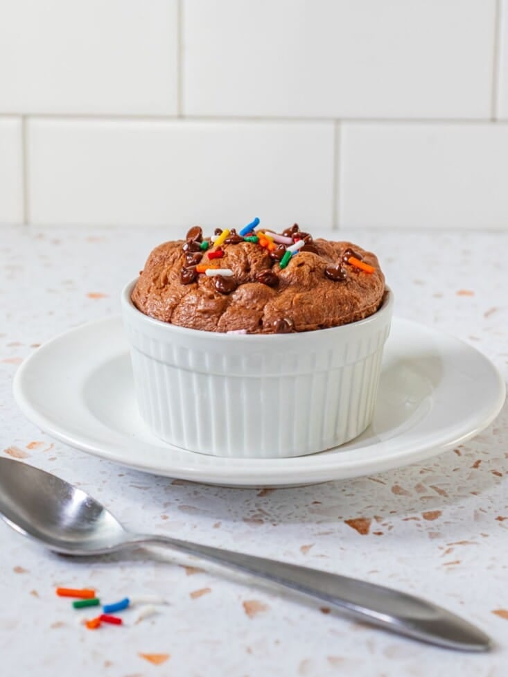 A protein cookie with sprinkles on top.