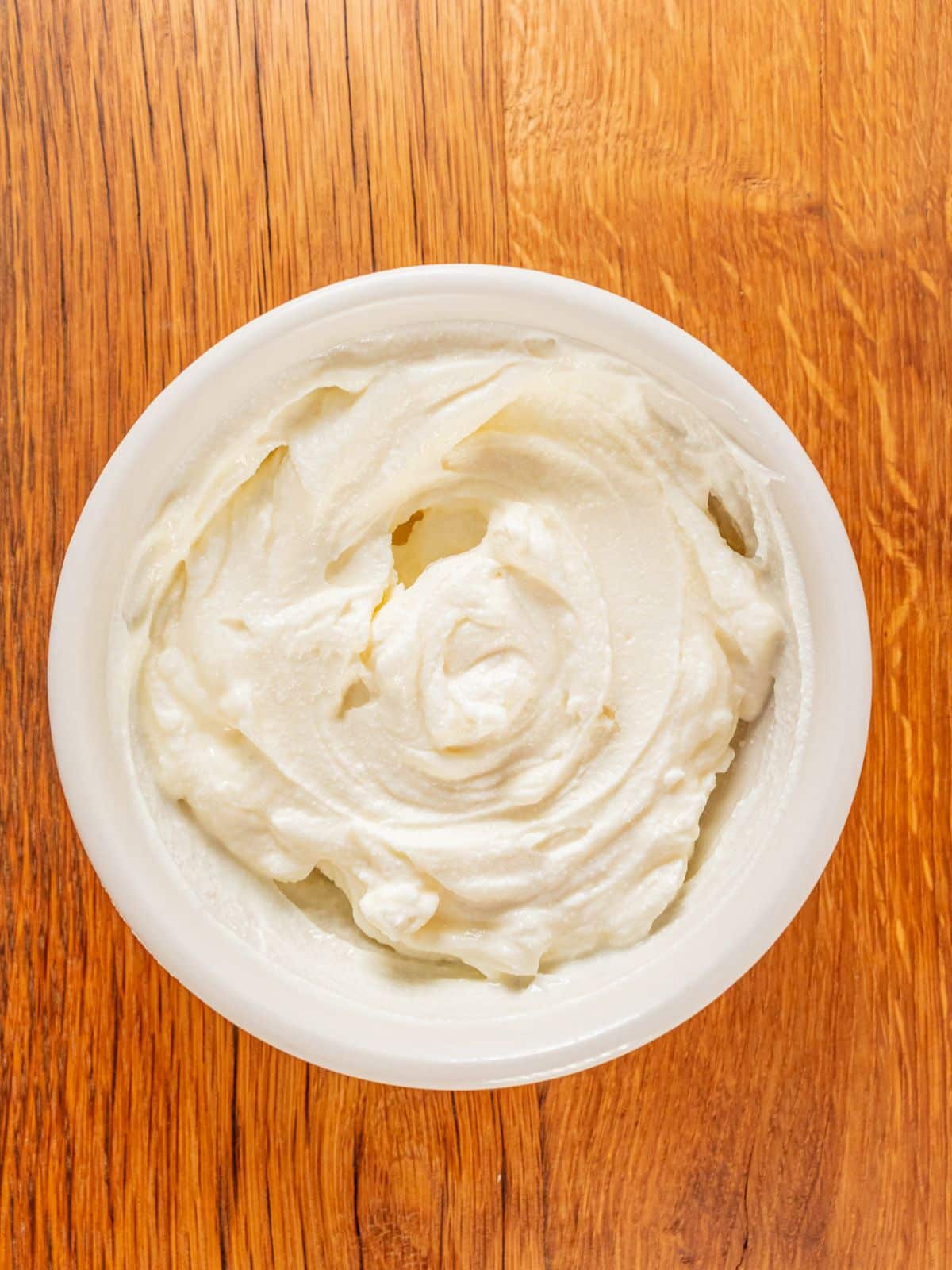 Cream cheese and sugar mixed in the bowl.