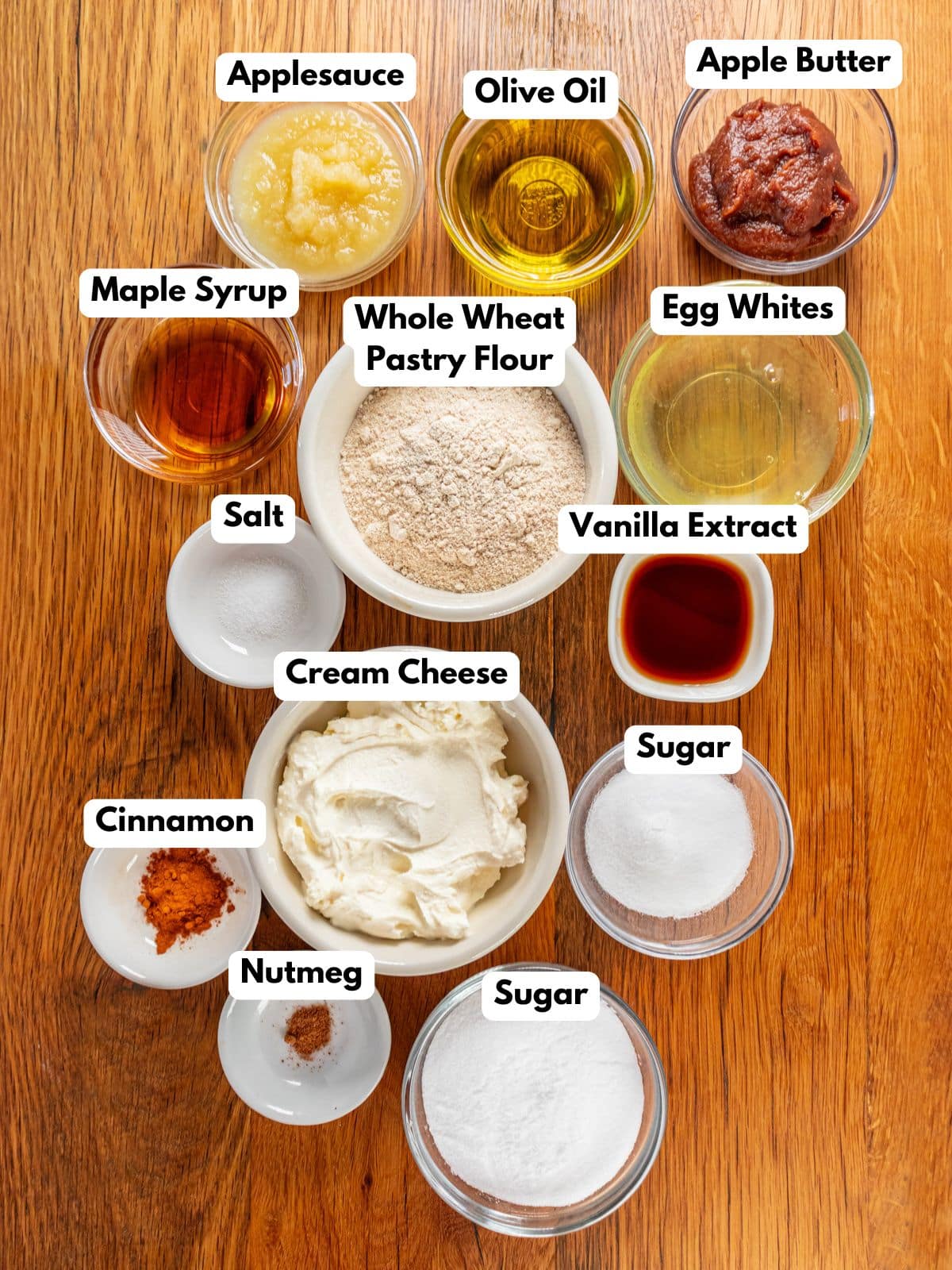 Ingredients to make these apple bars in bowls on a table.