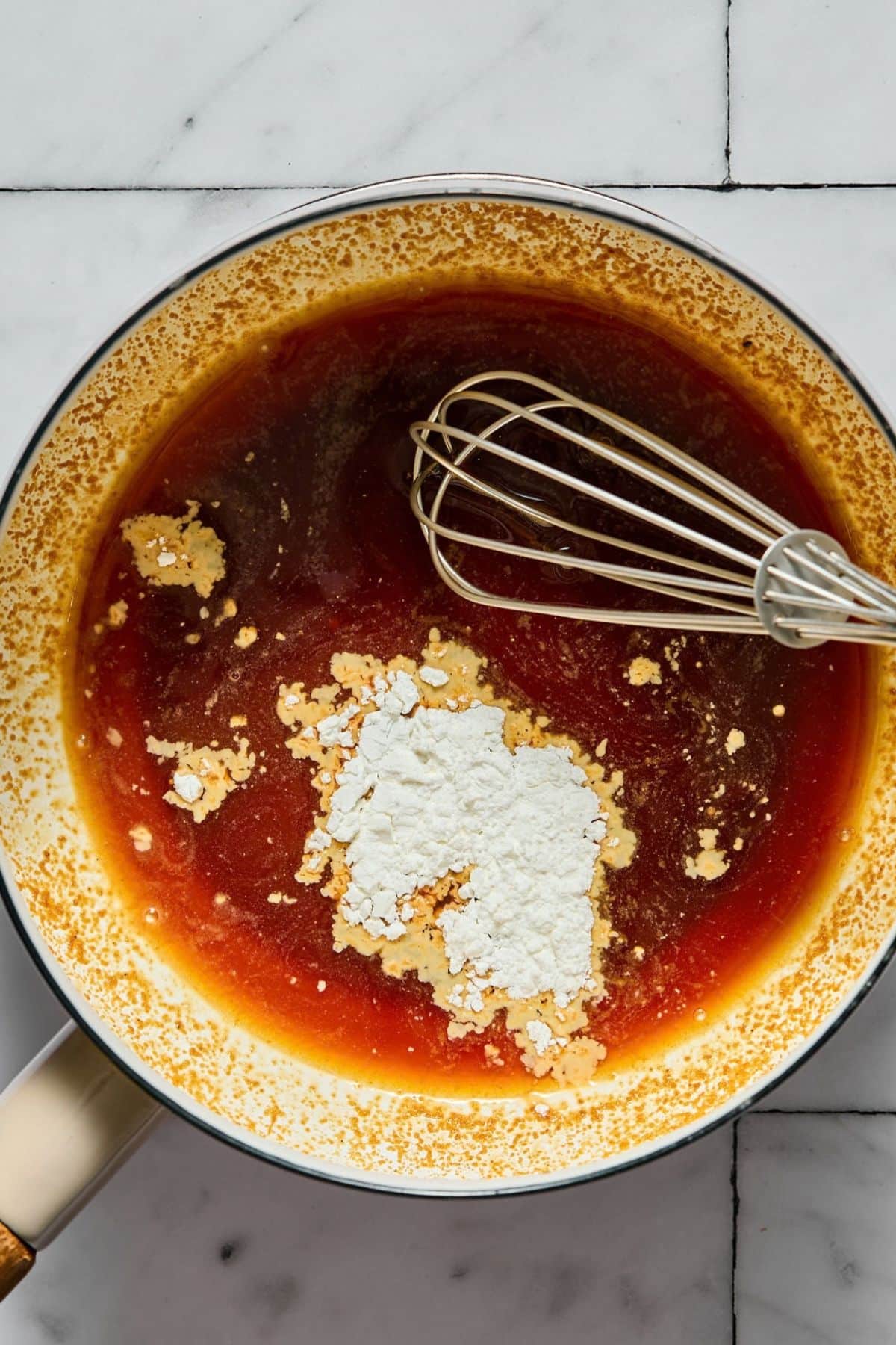 Rice vinegar, sugar, garlic powder, and ground ginger in a bowl.