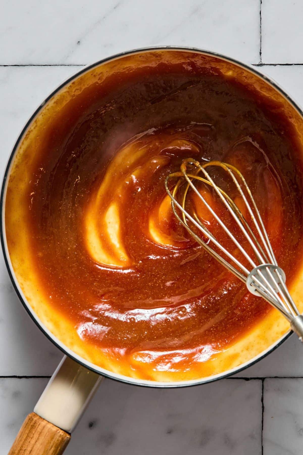 Sauce thickening in a pot.