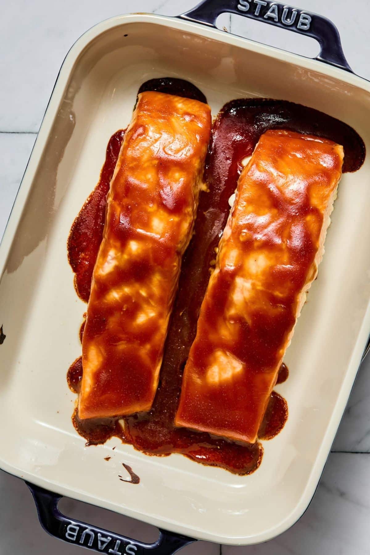 Teriyaki salmon cooked in a baking dish.