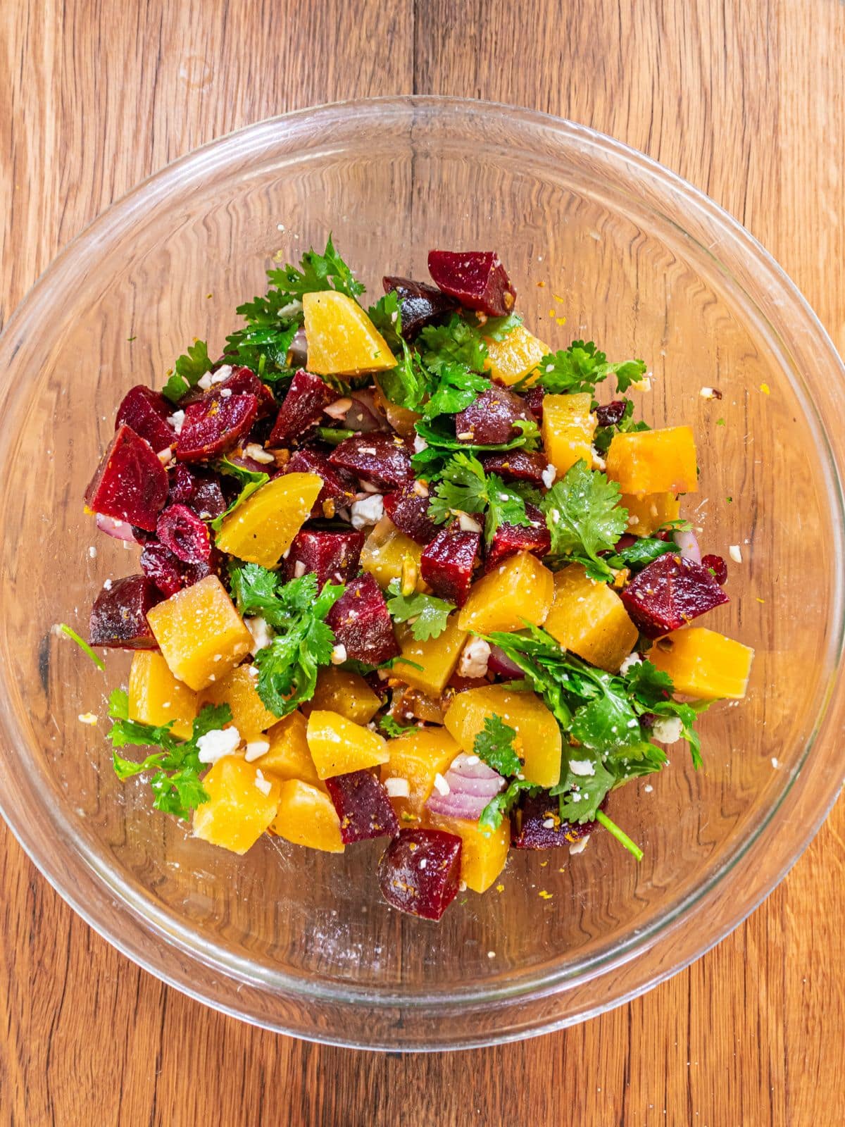 The cilantro, pistachios and feta crumbles added into the bowl.