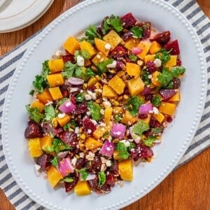 A plate filled with beet salad with feta.