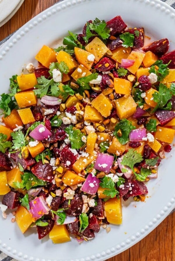A plate filled with beet salad with feta.