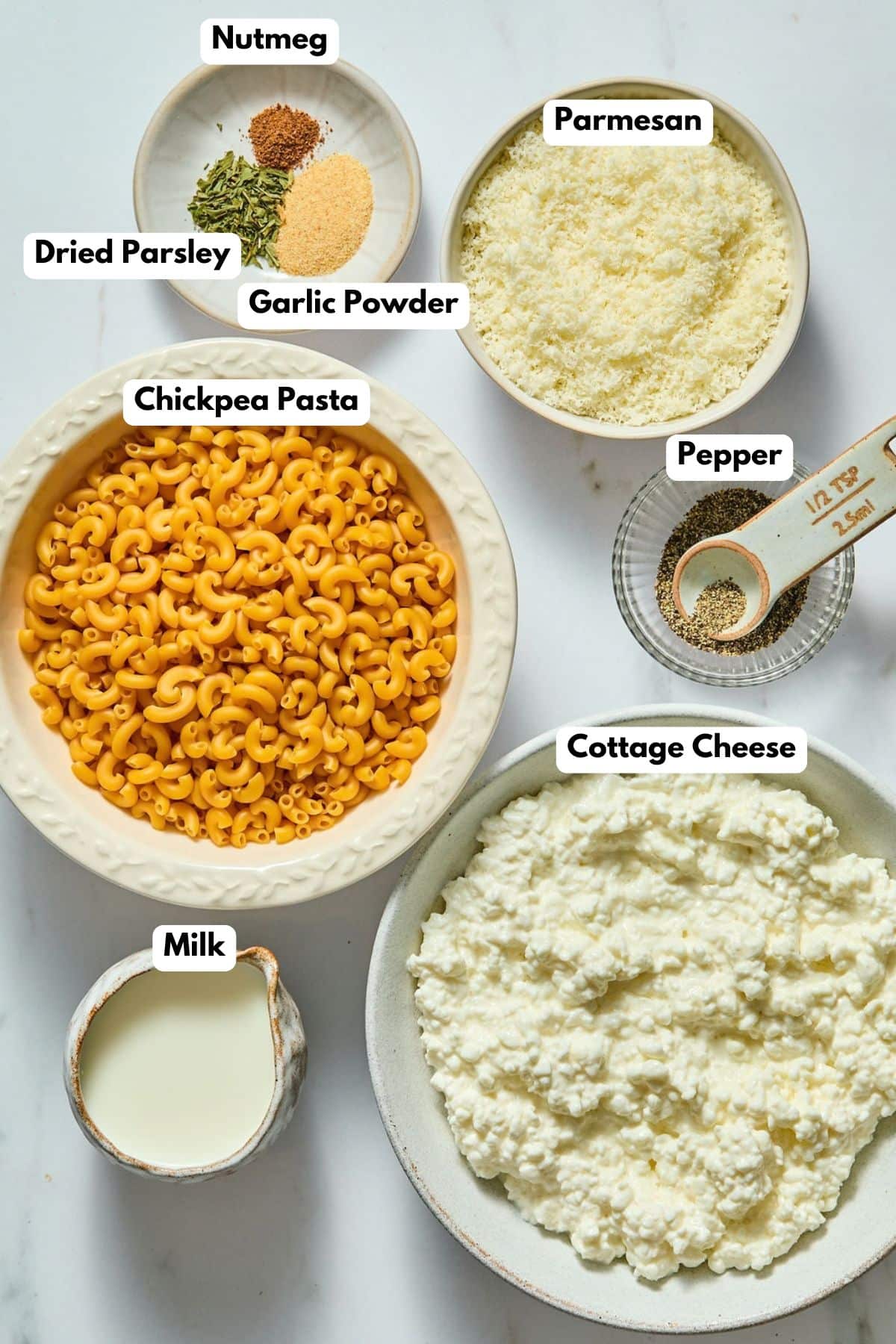 Ingredients to make this sauce in bowls on a table.