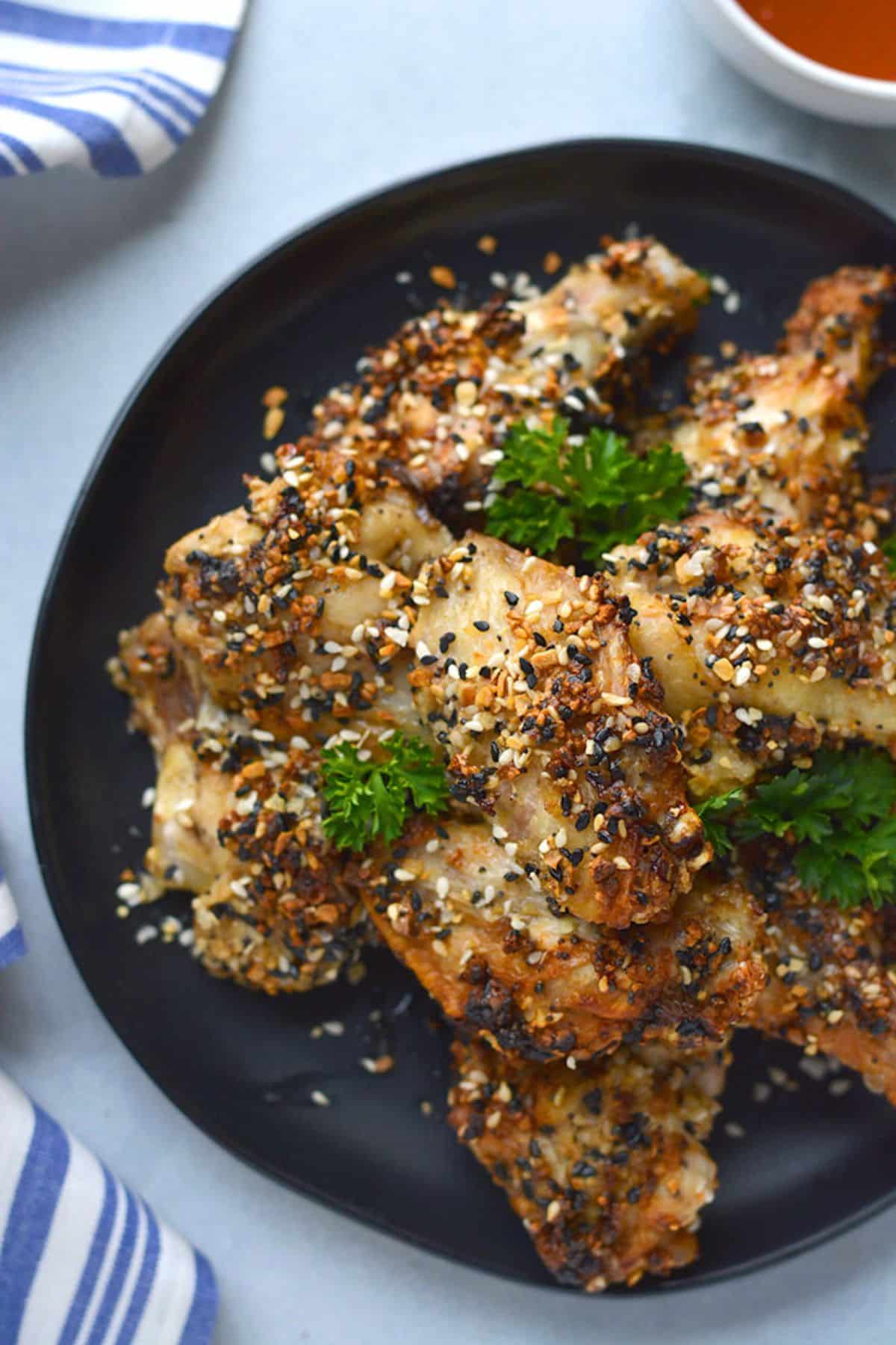 Chicken wings with everything but the bagel seasoning on top.