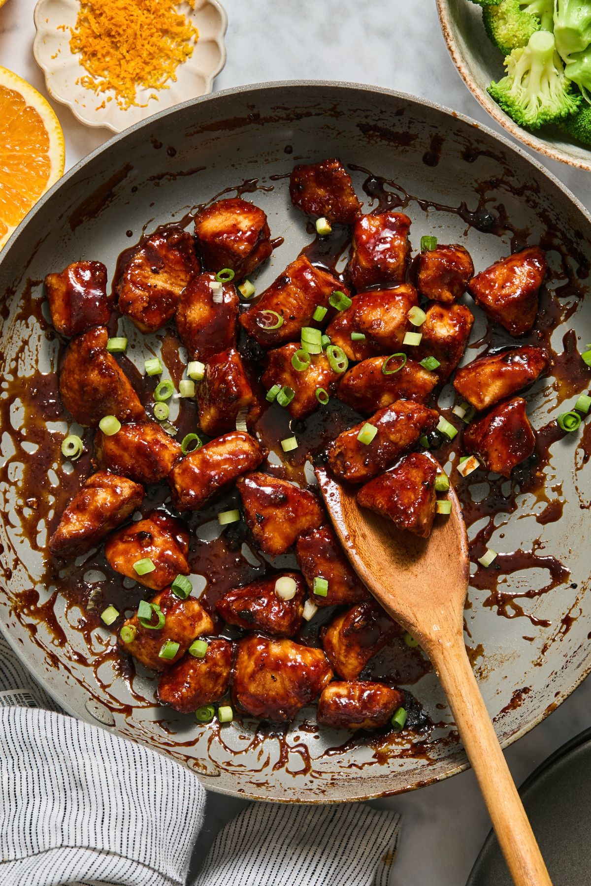 The chicken finished cooking on the skillet.