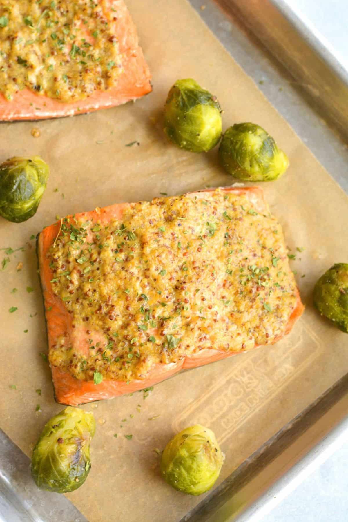 Salmon cooked in the air fryer on a baking sheet.