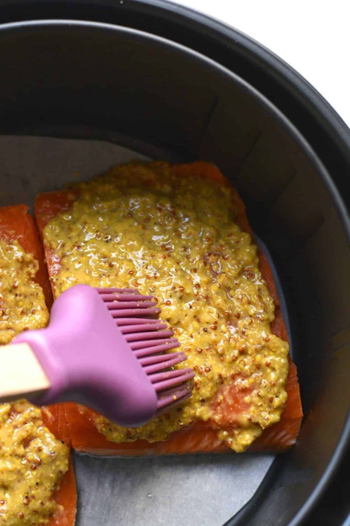 Mustard sauce brushed onto the salmon.