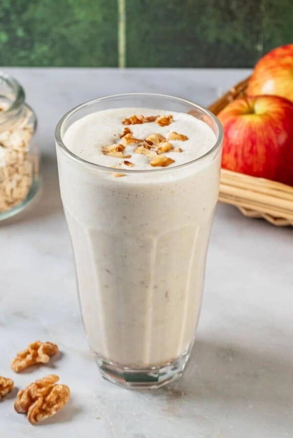 Apple smoothie with pecans on top.
