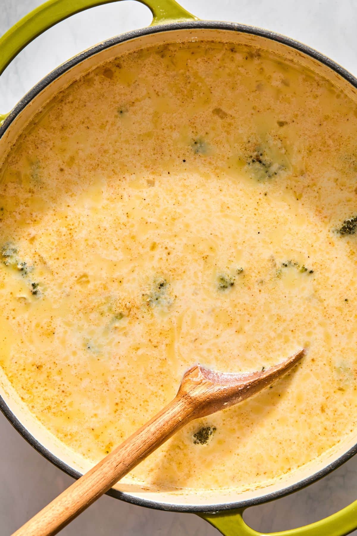 The butternut squash, broccoli, salt, pepper, chili powder, lime juice, and broth added to the pot.