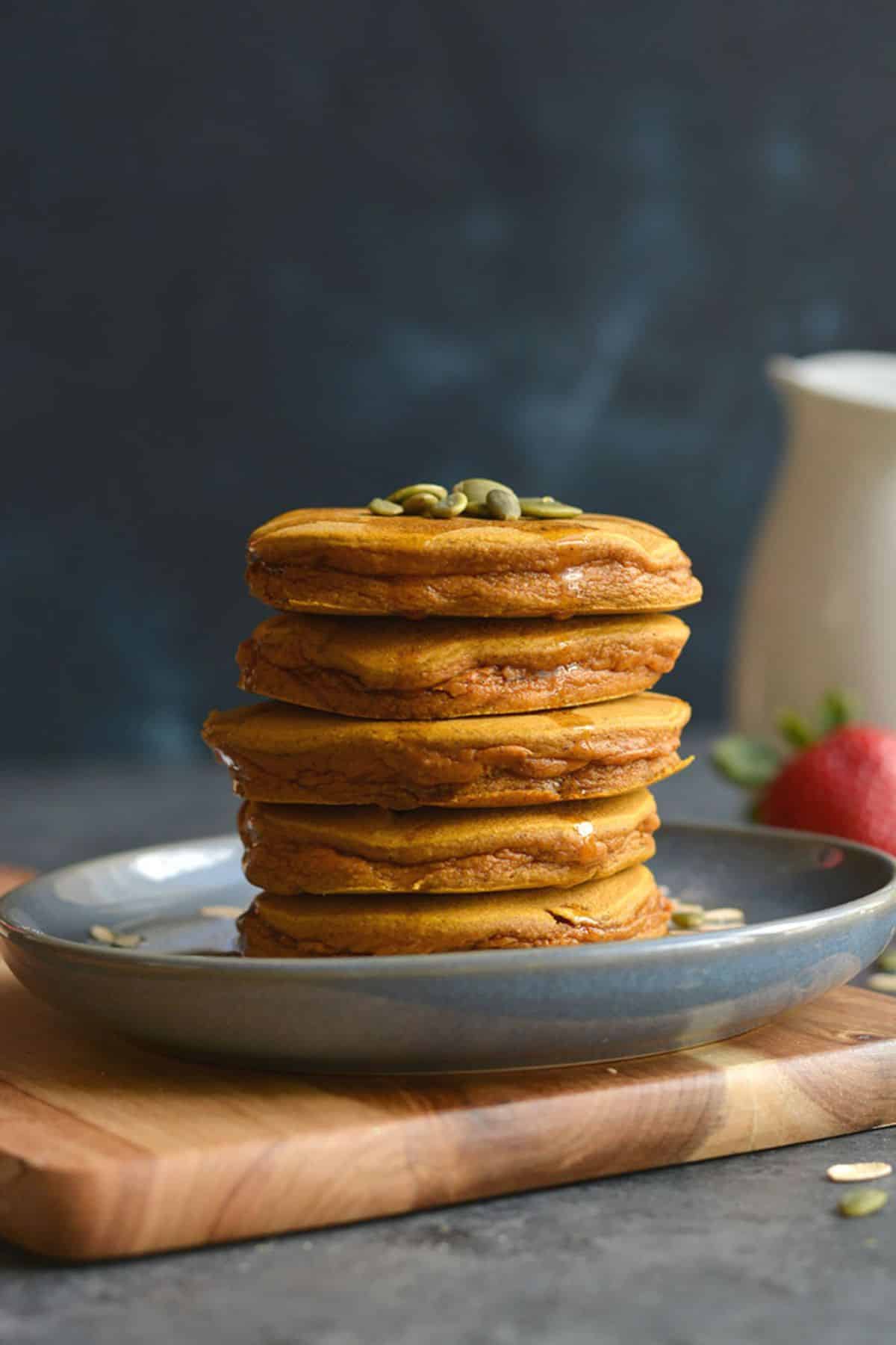A stack of pancakes on a plate.