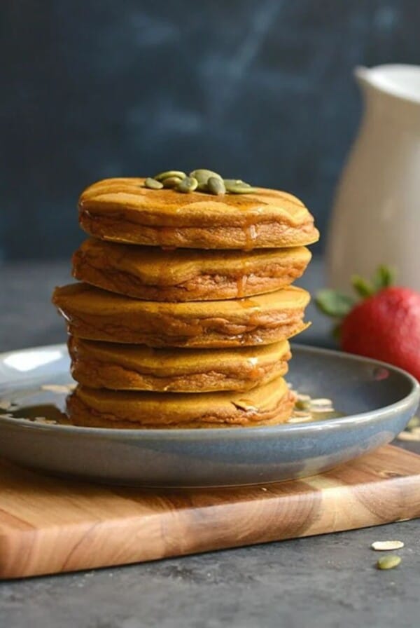 A plate stacked with butternut squash pancakes.