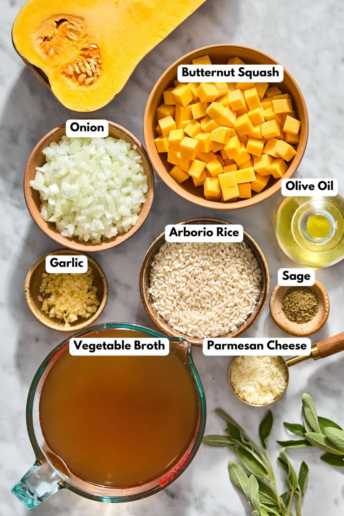 Ingredients to make this risotto with butternut squash in bowls on a table.